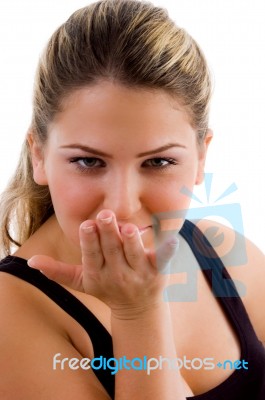 Young Female Giving Flying Kiss Stock Photo