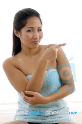 Young Female In Towel Indicating Aside Stock Photo