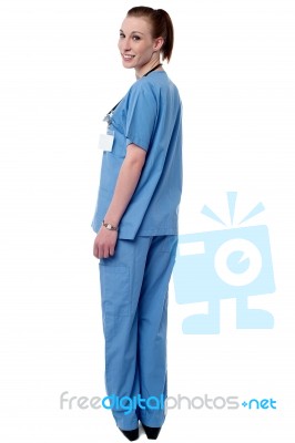 Young Female Physician Turning Back Stock Photo