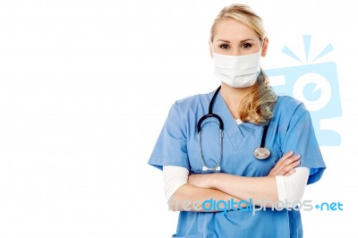 Young Female Surgeon Wearing Face Mask Stock Photo