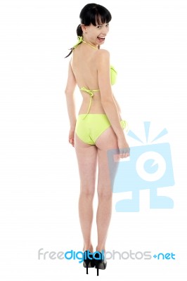 Young, Fit And Sexy Woman In Fluorescent Swimsuit Stock Photo