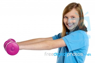 Young Fit Girl Exercising With Pink Dumbbells Stock Photo