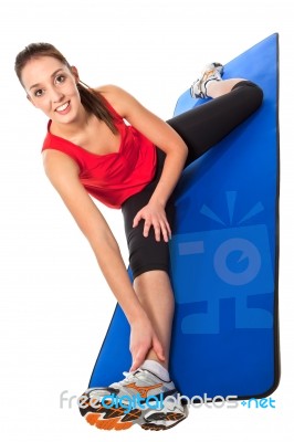 Young Fit Woman Exercising Stock Photo