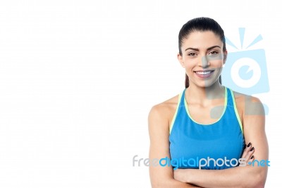 Young Fit Woman With Arms Folded Stock Photo