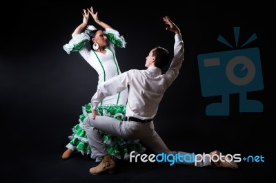 Young Flamenco Dancers In Beautiful Dress On Black Background Stock Photo