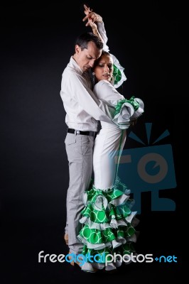 Young Flamenco Dancers In Beautiful Dress On Black Background Stock Photo