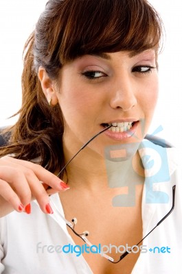 Young Girl Biting Specs Stock Photo