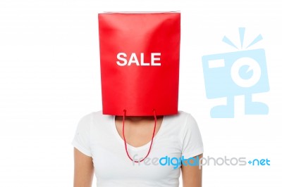 Young Girl Covering Her Face With Shopping Bag Stock Photo