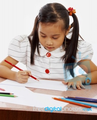 Young Girl Drawing Picture Stock Photo