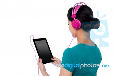 Young Girl Enjoying Music Stock Photo