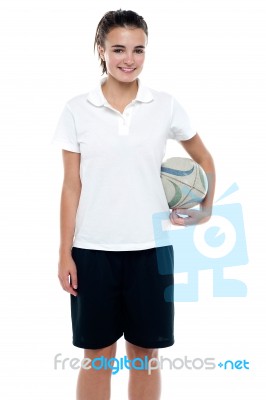 Young Girl Holding A Rugby Ball Stock Photo