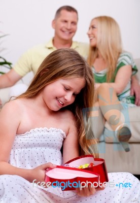 Young Girl Holding Gift Box Stock Photo