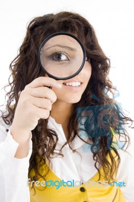 Young Girl Holding Magnifying Glass Stock Photo