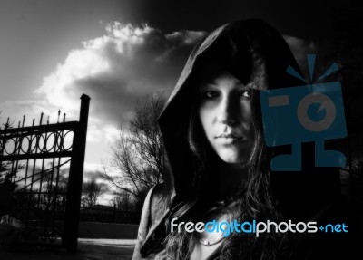 Young Girl In A Dress With A Hood Stock Photo