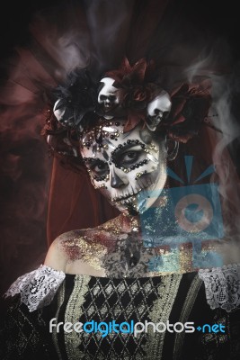 Young Girl In The Image Of Santa Muerte Stock Photo