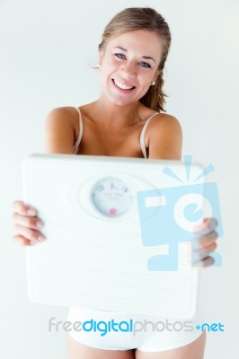 Young Girl In Underwear Holding Scales Stock Photo