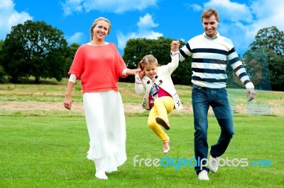 Young girl jumping in outdoors Stock Photo