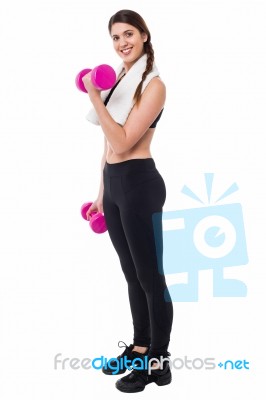 Young Girl Lifting Dumbbells, Biceps Exercise Stock Photo