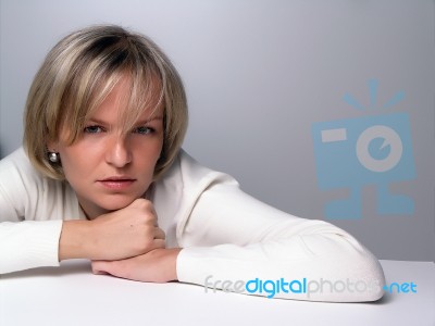 Young Girl Lying On Table Stock Photo