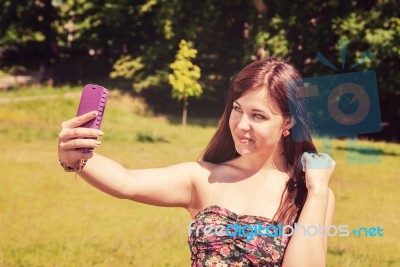 Young Girl Making Selfie In A Park Stock Photo