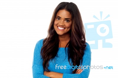 Young Girl Posing With Her Arms Crossed Stock Photo