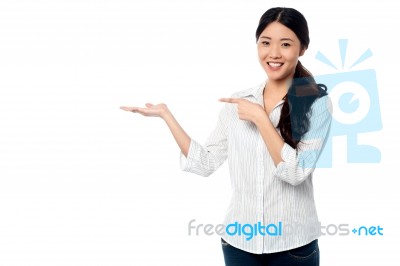 Young Girl Promoting A Product Stock Photo