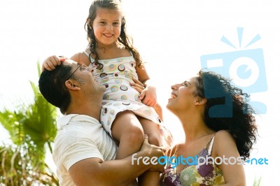 Young Girl Sitting On Shoulders Stock Photo