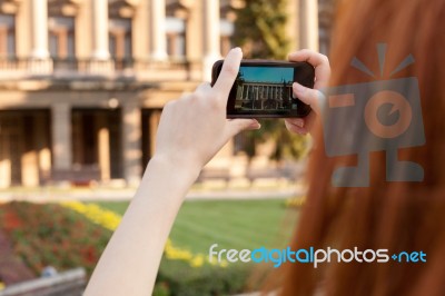 Young Girl Taking Pictures Of The City Stock Photo