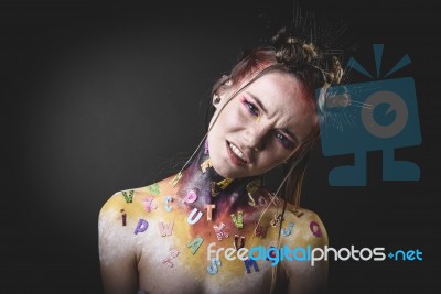 Young Girl With Creative Alphabet Makeup Stock Photo