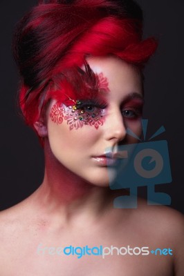 Young Girl With Red Hair And Creative Ingenious Makeup Stock Photo