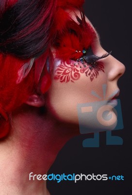 Young Girl With Red Hair And Creative Ingenious Makeup Stock Photo