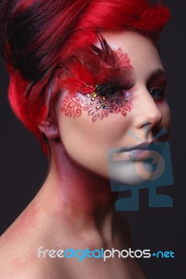 Young Girl With Red Hair And Creative Ingenious Makeup Stock Photo