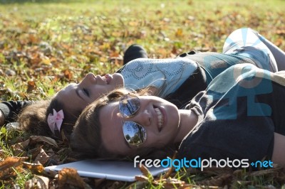 Young Girls And Tablet Pc Stock Photo