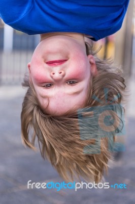 Young Girls Head Hanging Upside Down Stock Photo