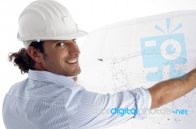 Young Good Looking Architect Showing Blueprints Stock Photo