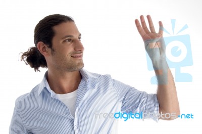 Young Good Looking Man With Counting Fingers Stock Photo