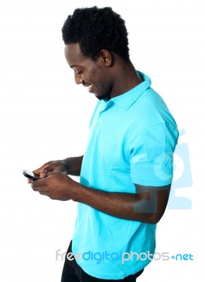 Young Guy Busy Messaging Stock Photo