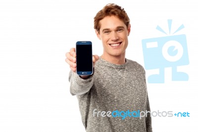 Young Guy Displaying Brand New Cellphone Stock Photo