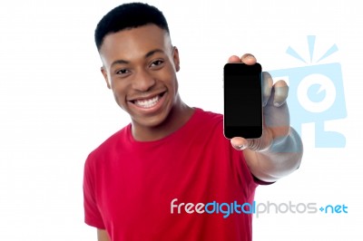 Young Guy Displaying Brand New Cellphone Stock Photo