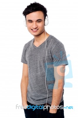 Young Guy Enjoying Music Stock Photo