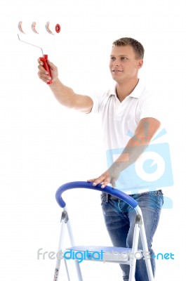 Young Guy Holding Rolling Brush Stock Photo