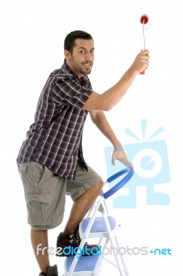 Young Guy Holding Rolling Brush Stock Photo