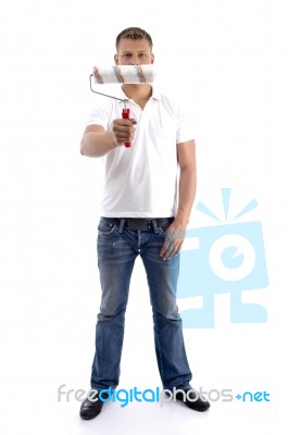 Young Guy Holding Rolling Brush Stock Photo