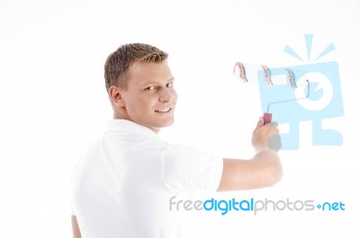 Young Guy Holding Rolling Brush Stock Photo