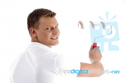 Young Guy Holding Rolling Brush Stock Photo