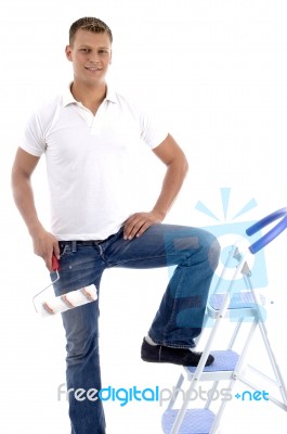 Young Guy Holding Rolling Brush Stock Photo