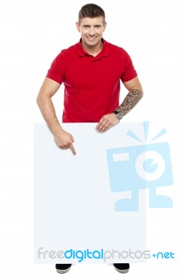 Young Guy Pointing Blank Board Stock Photo