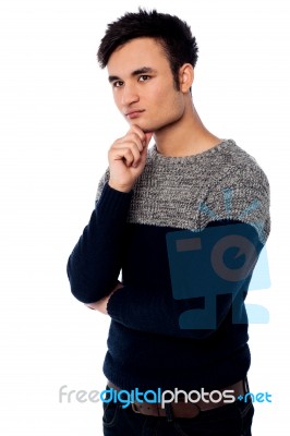 Young Guy Thinking Of Something Stock Photo