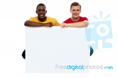 Young Guys Holding Blank Board Stock Photo