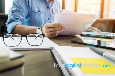 Young Handsome Business Man Working With Documents In The Office… Stock Photo